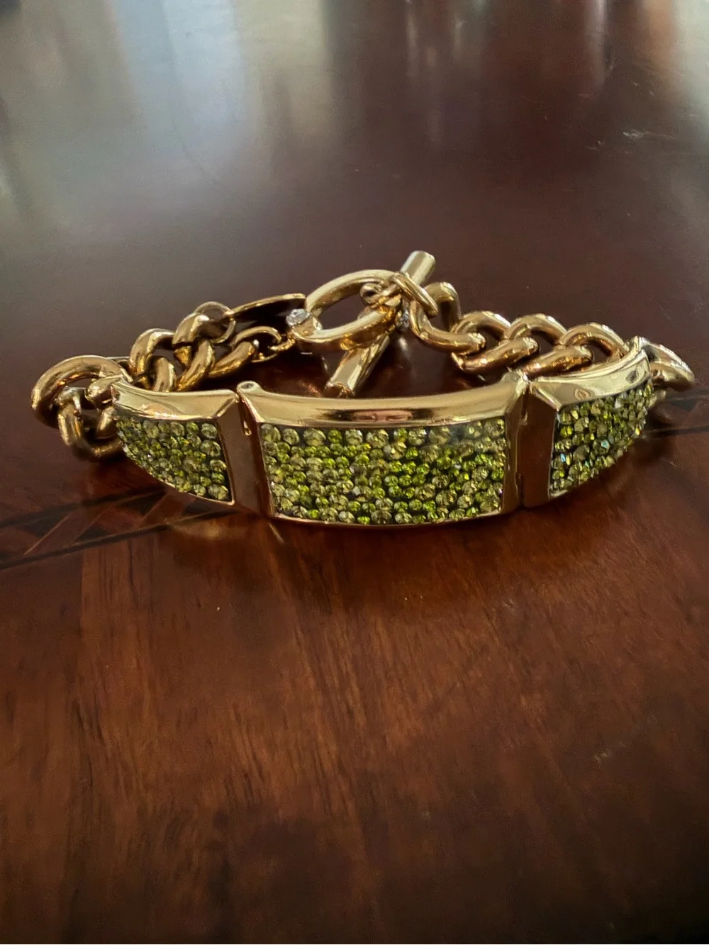 Henri Bendel Gold Tone Bracelet with Green Crystals Toggle Closure 7.5”